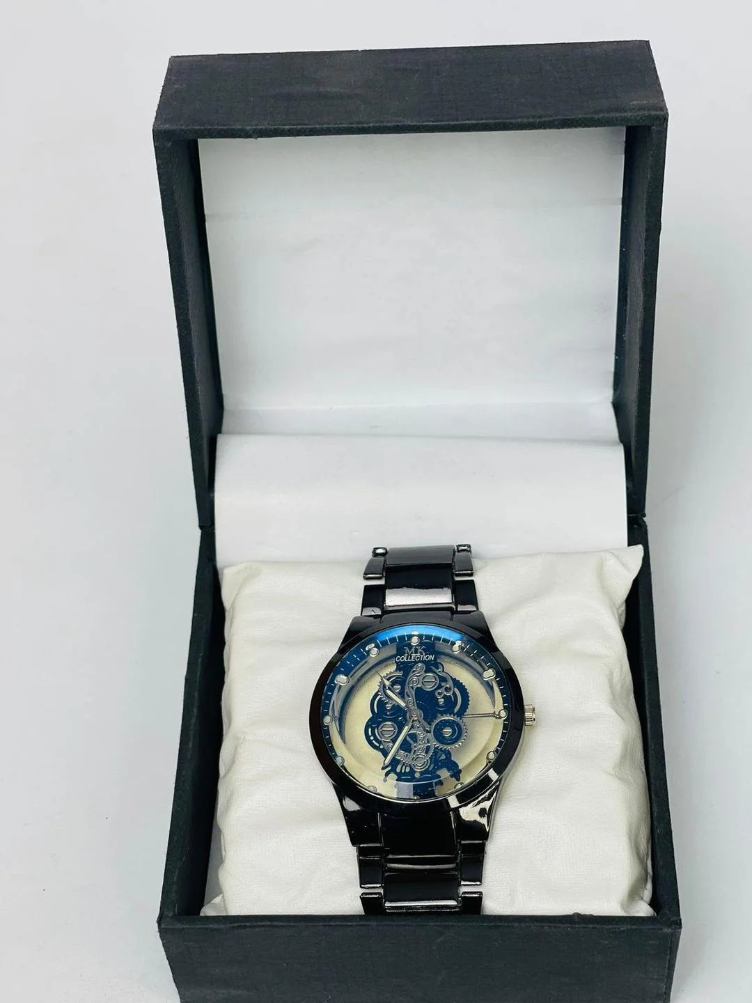 Black steel skeleton watch for men – gear dial close-up