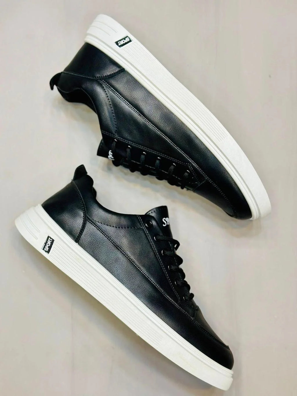 Black Rexine casual men's sneakers – front view