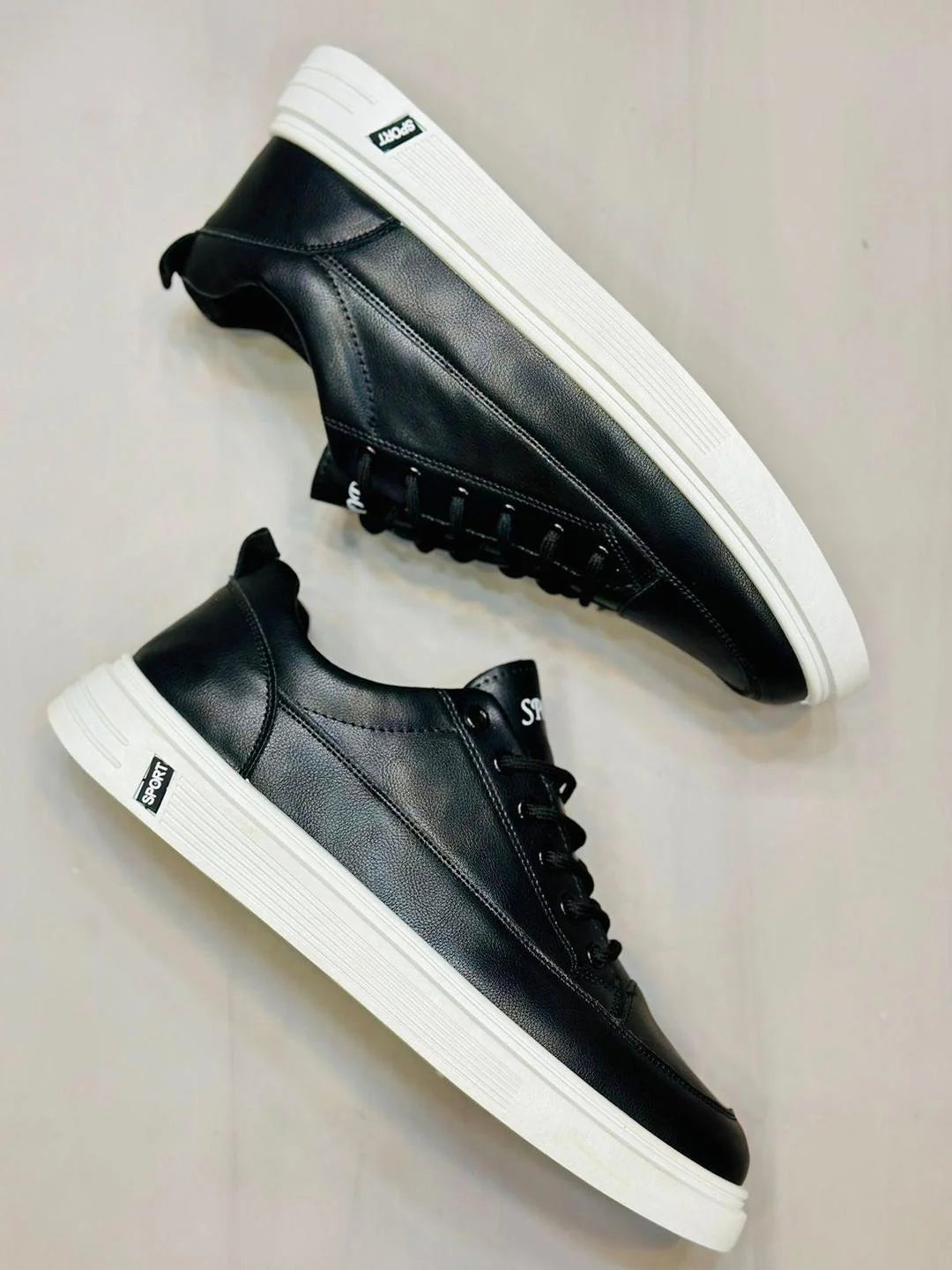 Black Rexine casual men's sneakers – front view